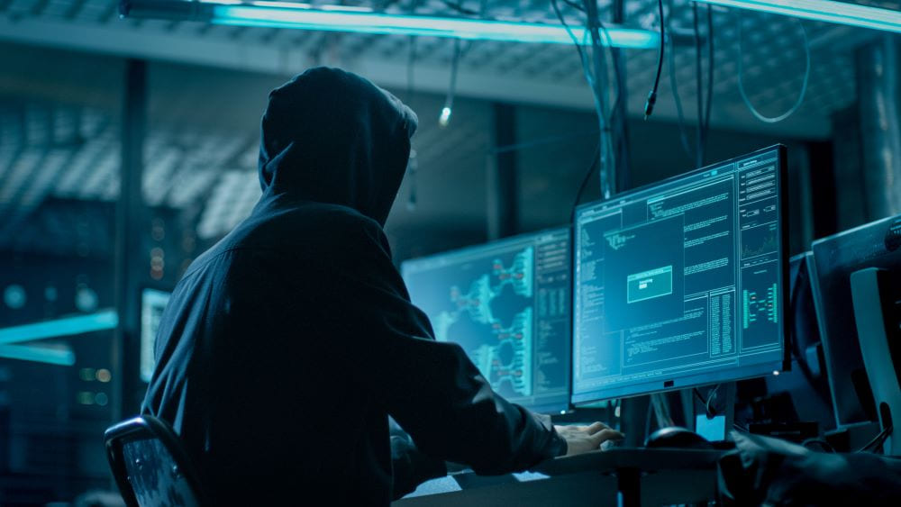 A hacker running code on a computer